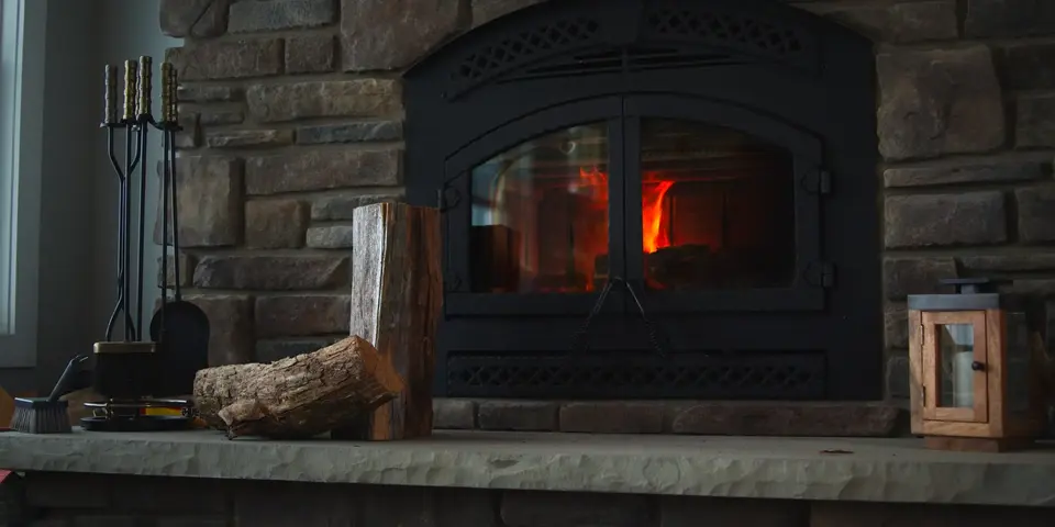 A stone hearth with a fire burning
