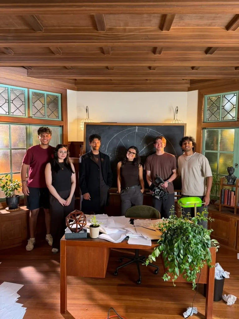 Cast and crew together on the finished set